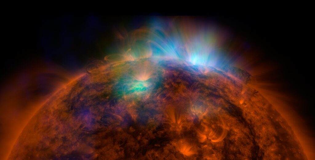 X-rays stream off the sun in this first picture of the sun, overlaid on a picture taken by NASA Solar Dynamics Observatory SDO, taken by NASA NuSTAR. The field of view covers the west limb of the sun.